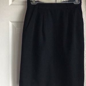 Classic black wool skirt with full lining.